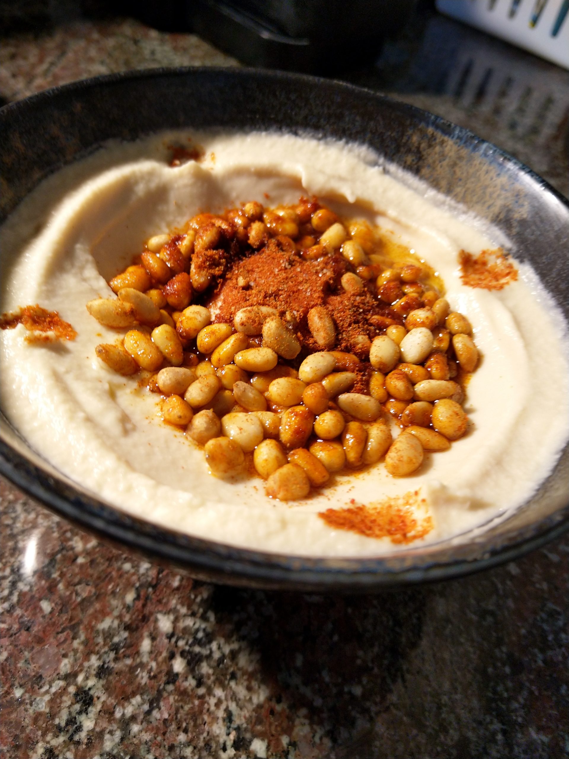 Hummus with pine nuts